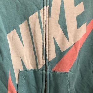 Blue nike jacket with peach accent